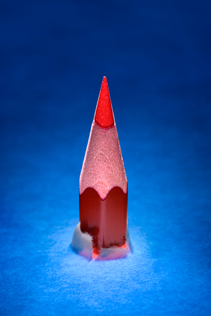 Red pencil and white paper  A dark art background の写真素材