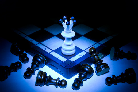 Chess board, queen and pawns  A dark blue art background の写真素材