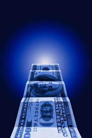  Hundred dollars on a dark blue art background の写真素材
