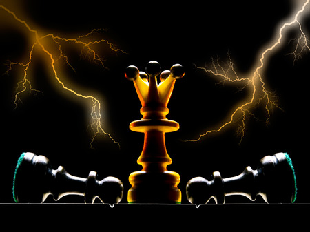 Chessmen on a chess board  A dark background and art illumination の写真素材