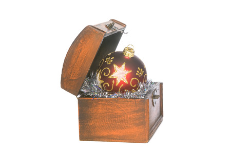 Red decorative sphere (in a casket) on an isolated white background.の写真素材