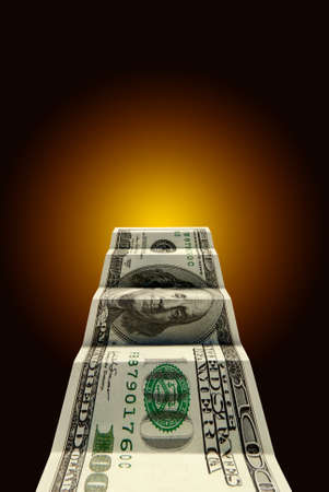 Hundred dollars on a dark blue art background.の写真素材