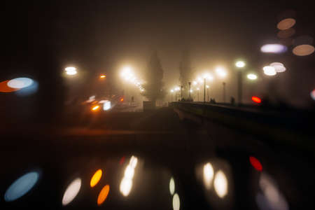 Busy traffic in city fog blur lights of cars on roadの写真素材