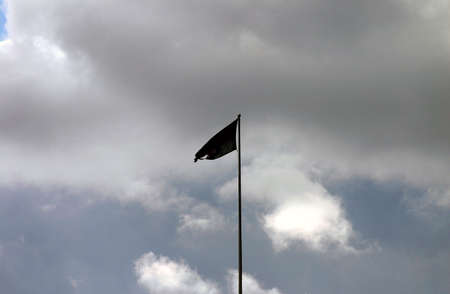 Tattered Flag Silhouetteの写真素材