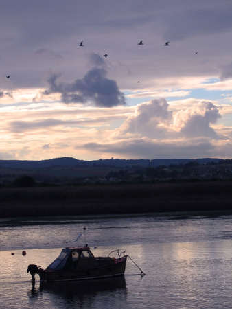 Pleasure Boat at Sunset on South Devon Riverの写真素材