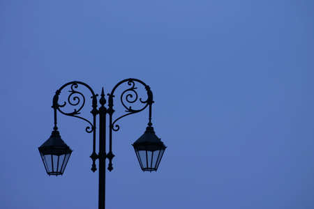 Sihouette of Old Street Light Against Blue Skyの写真素材