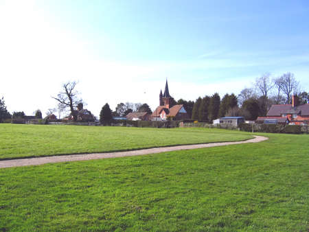 Village Green and Church in Cheshire Village of Aldfordの写真素材