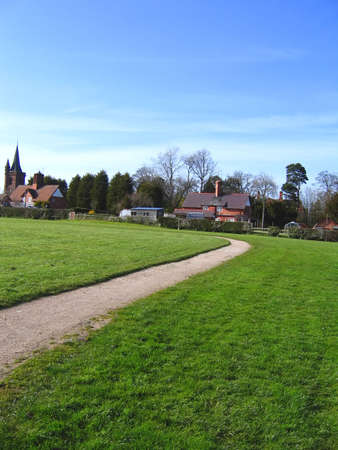 Village Green and Church in Cheshire Village of Aldfordの写真素材