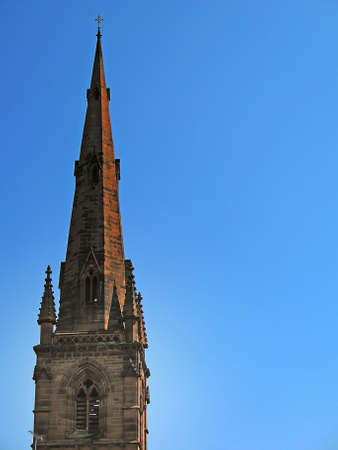 Church Spire in Chester England UK against blue sky in springの写真素材