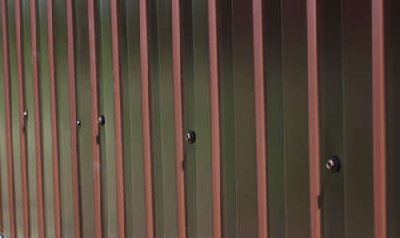 Fence of corrugated metalの写真素材