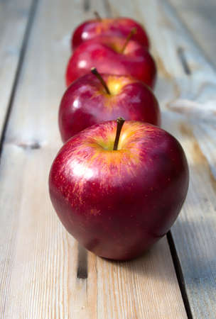 Autumn harvest of apples. Red apples on a wooden background. Healthy eatingの写真素材