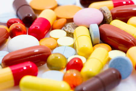 Many pills and tablets white on backgroundの写真素材