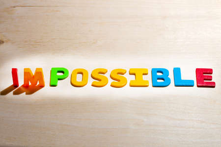 Impossible text on brown backgroundの写真素材