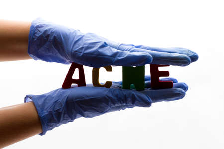 word acne in outstretched handsの写真素材