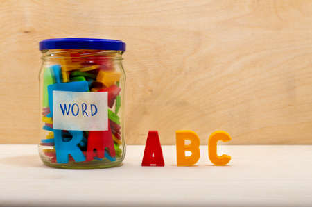 Colorful alphabet in a glass jarの写真素材