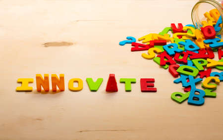 Innovate text on wood backgroundの写真素材