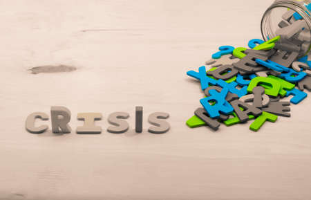 Crisis text on wood background