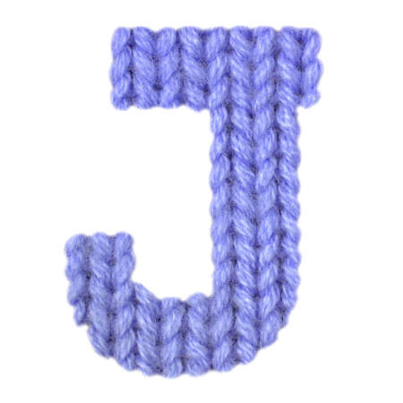 Letter J alphabet on a blurry texture knitted pattern of woolen thread closeup. One letter of the English alphabet. Education and holidays. Typography design. Color dark blueの写真素材