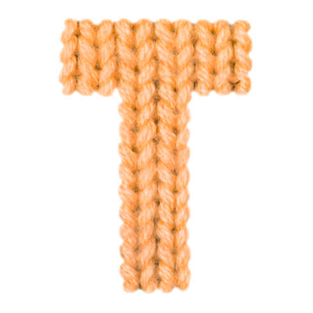 Letter T alphabet on a blurry texture knitted pattern of woolen thread closeup. One letter of the English alphabet. Education and holidays. Typography design. Color orangeの写真素材