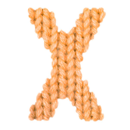 Letter X alphabet on a blurry texture knitted pattern of woolen thread closeup. One letter of the English alphabet. Education and holidays. Typography design. Color orangeの写真素材