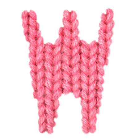 Letter W alphabet on a blurry texture knitted pattern of woolen thread closeup. One letter of the English alphabet. Education and holidays. Typography design. Color redの写真素材