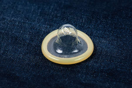 Condom on blue jeansの写真素材