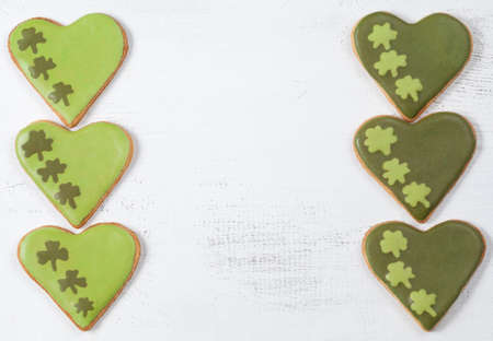 Patricks day green cookies with icing clover on vintage white background top viewの写真素材