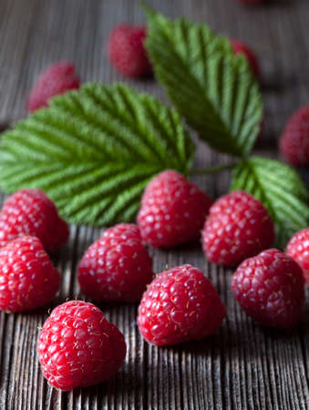 Raspberries fresh organic summer food. Healthy vegetarian diet sweet dessert. Superfoods. Dark food...