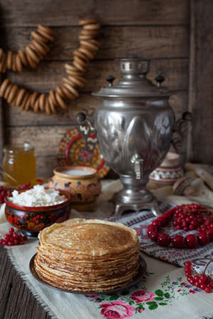 Traditional Ukrainian pancakes with cottage cheese and milk on vintage wooden table backgroundの写真素材