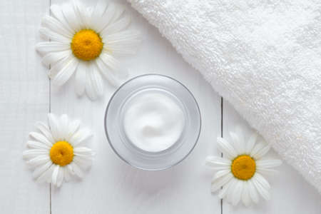 Herb cosmetic anti wrinkle cream with chamomile vitamin spa lotion natural organic moisturizer cleansing product. Dermatology hygienic anti aging, acne, blemish, pimple, blackhead clear treatmentの写真素材