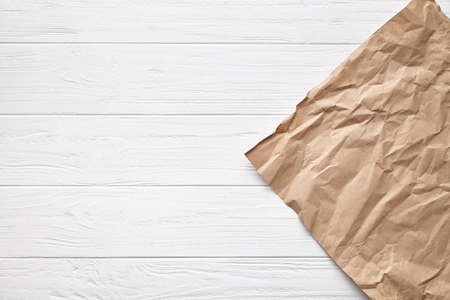 White wooden table background board texture with aged decorative parchment paper backdrop frame
