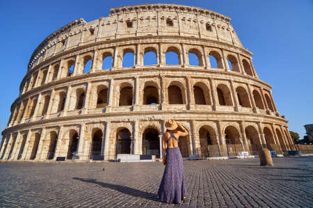 Colosseum and young tourist woman near gladiator arenaの写真素材