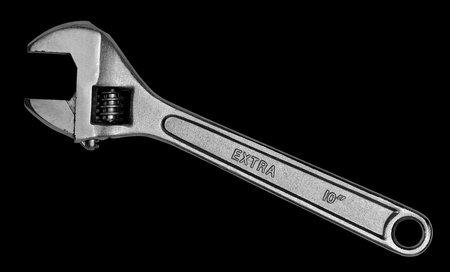 Adjustable wrench, isolated on black
