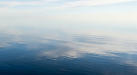 Reflection of the sky and clouds on the water surface of the seaの素材