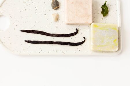 oliva and vanila Soap from soy wax with vsprig of eucalyptus on a white marble boardwhite...