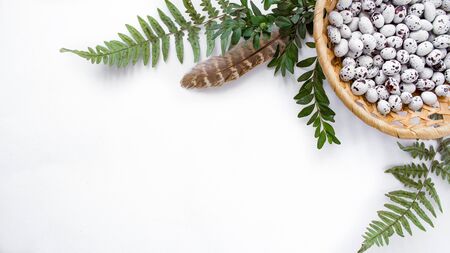 top view easter composition from the corner with chocolates in the form of quail eggs with natural...