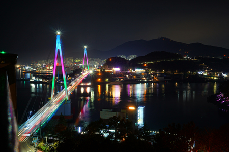 Night view of beautiful bridge and village (in Yeo Su Korea)の写真素材