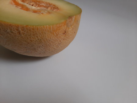 Top view fresh half cut melon on isolated white backgroundの写真素材