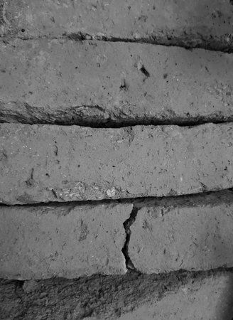 Monochrome unused grey terra cotta brick texture full frame close up for constructionの写真素材