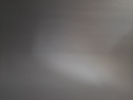 Blurred abstract grey or gray background with sunlightの写真素材