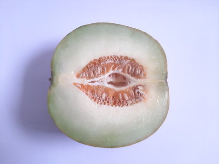 Top view fresh half cut melon on isolated white backgroundの写真素材