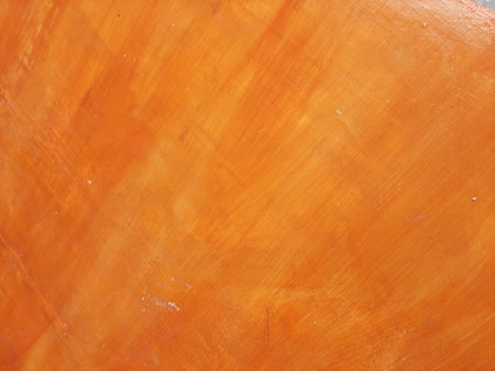 Orange or brown varnished wood background textureの写真素材
