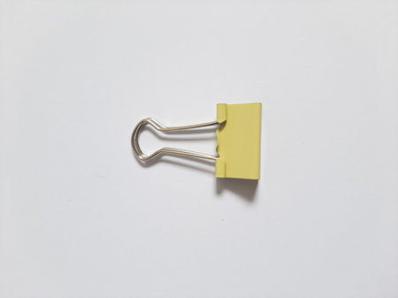 Binder or paper clip or office bind clip, stationery, realistic object on isolated white backgroundの写真素材
