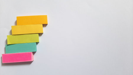 Pastel and Neon Sticky Notes or Paper Index or Page Marker or Flags Tabs or Note Adhesive Post Highlighter or Memo Pads for Highlighting Documents on Isolated White Backgroundの写真素材