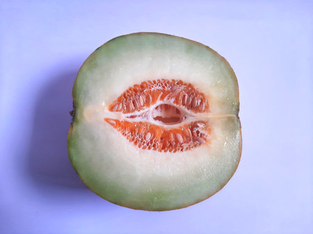 Top view fresh half cut melon on isolated white backgroundの写真素材
