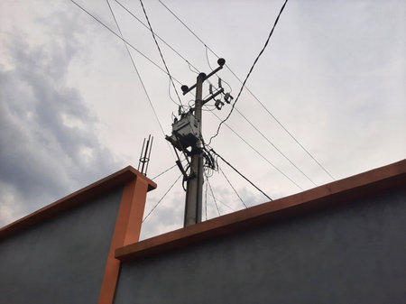 Electric cable and pole on a gloomy day or overcast sky,の写真素材
