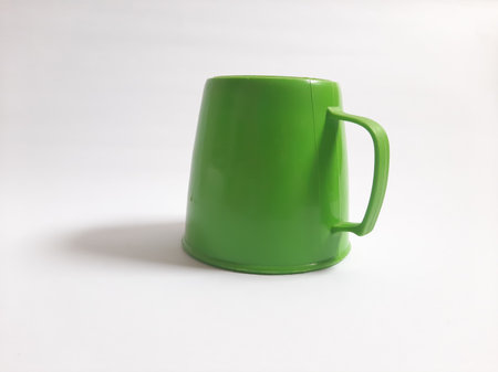 Empty green cup on isolated white backgroundの写真素材