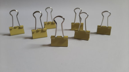Binder or paper clip or office bind clip, stationery, realistic object team group metaphor on isolated white backgroundの写真素材