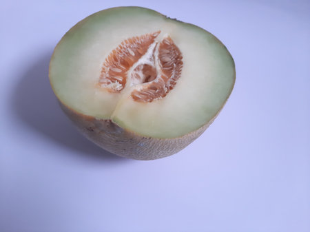 Top view fresh half cut melon on isolated white backgroundの写真素材
