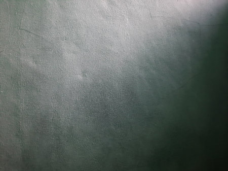 Empty solid grey or gray paint wall background with sunlight.の写真素材